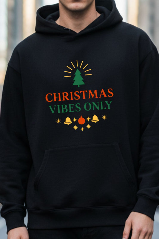 Black hoodie with 'Christmas Vibes Only' text and graphics on a blurred background