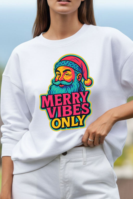 close up of a woman wearing a white oversized sweatshirt with a colorful graphic and text 'Merry Vibes Only'.