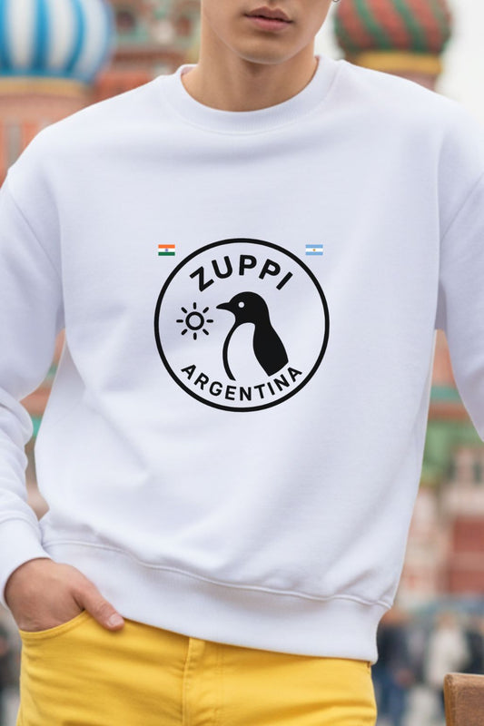 close up of a man wearing a white sweatshirt with a black logo and text, standing in front of a blurred colorful background.