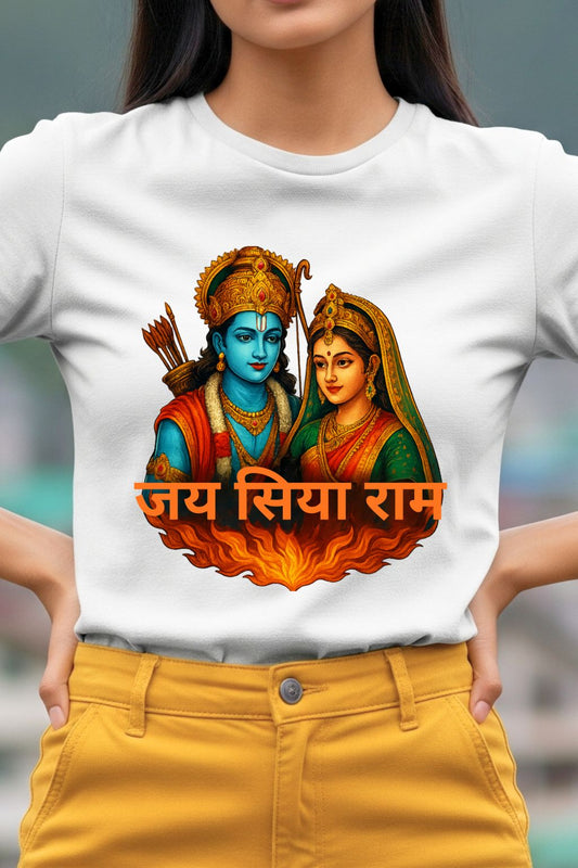 Woman wearing a white t-shirt with a colorful graphic and text, standing against a blurred background.