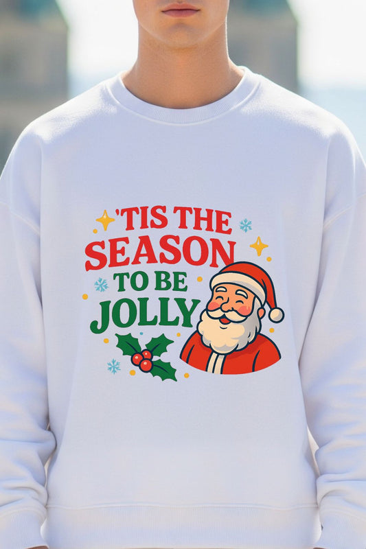 close up of a white oversized sweatshirt with Santa Claus graphic and 'Tis the Season to be Jolly text.