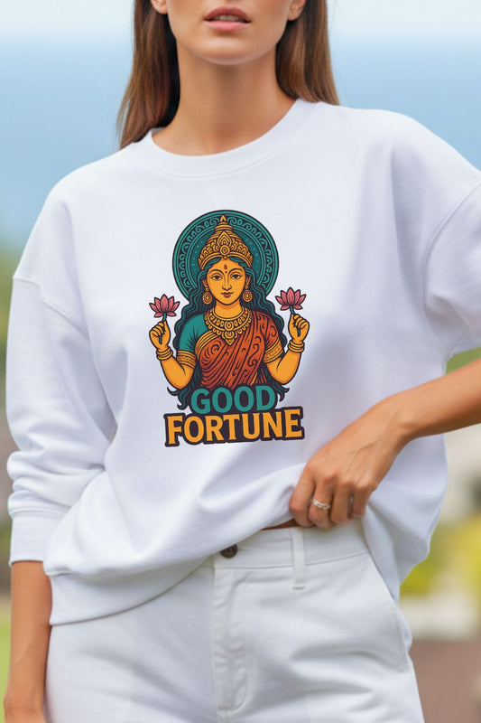 close up of a woman wearing a white oversized sweatshirt with a colorful 'Good Fortune' design.