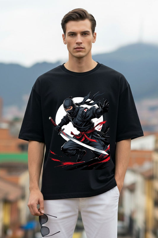 Man wearing a black t-shirt with a graphic design of a ninja in an outdoor setting