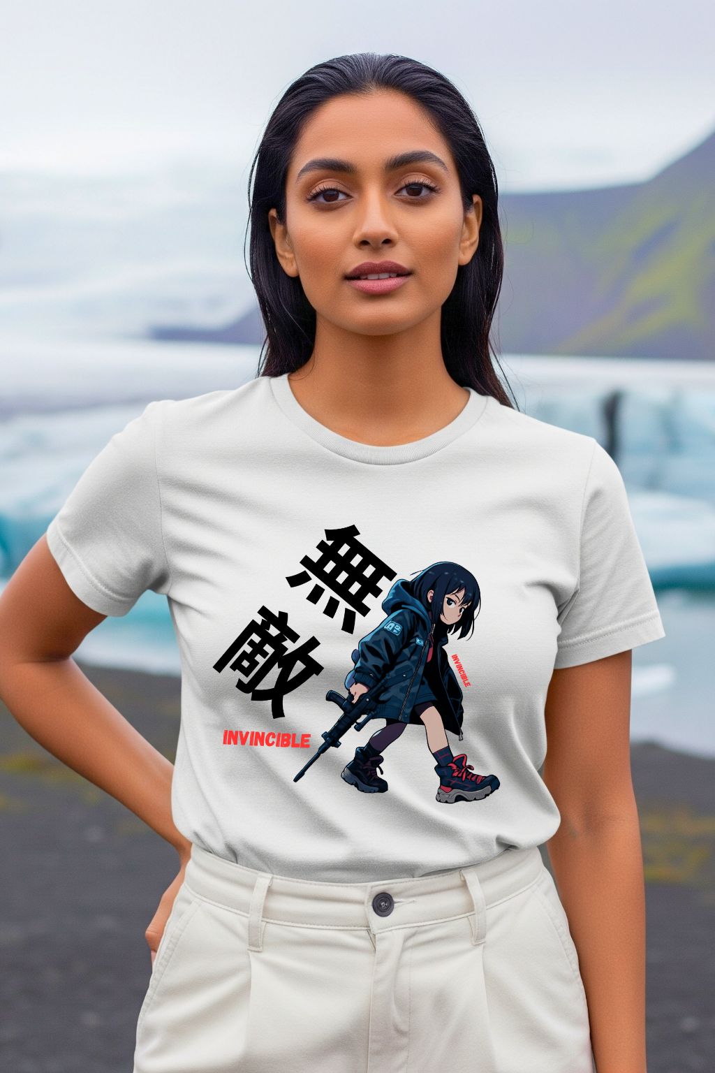 Woman wearing a white t-shirt with a graphic design and text, standing outdoors.