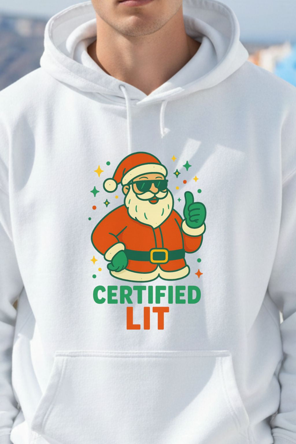 close up of a white oversized hoodie with a colorful graphic of Santa Claus and text 'CERTIFIED LIT' on a blurred background