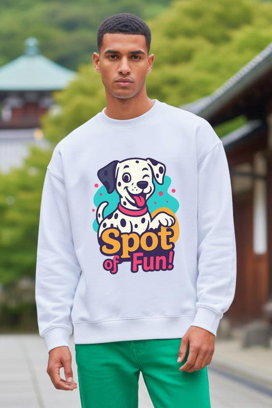 Man wearing a white oversized  sweatshirt with a colorful dog graphic and 'Spot of Fun!' text, standing outdoors.