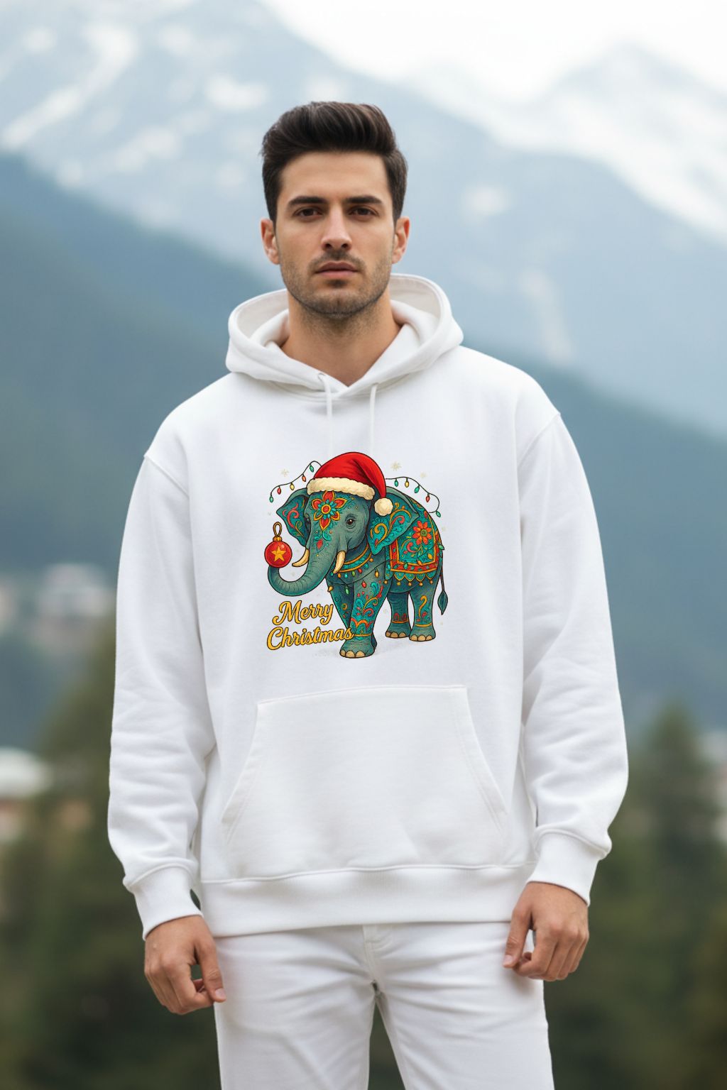 Man wearing a white hoodie with a colorful elephant design outdoors