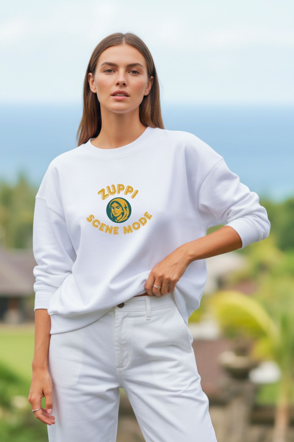Woman wearing a white sweatshirt with 'Zuppa Scene Mode' logo outdoors.