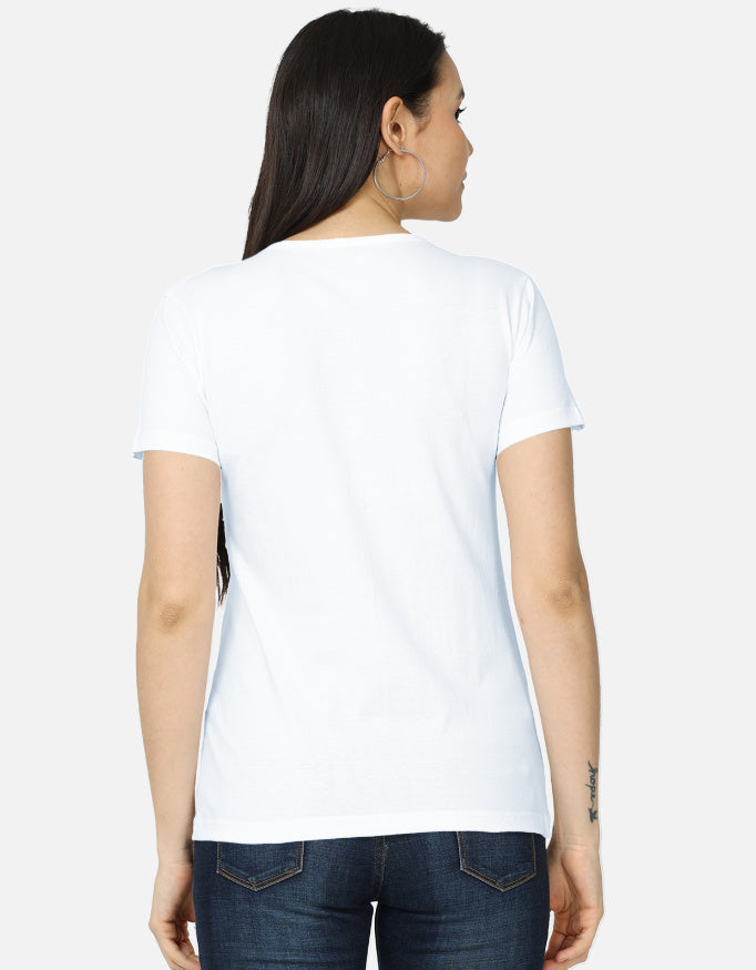 Back view of the ZUPPI women's white t-shirt, styled with blue jeans.