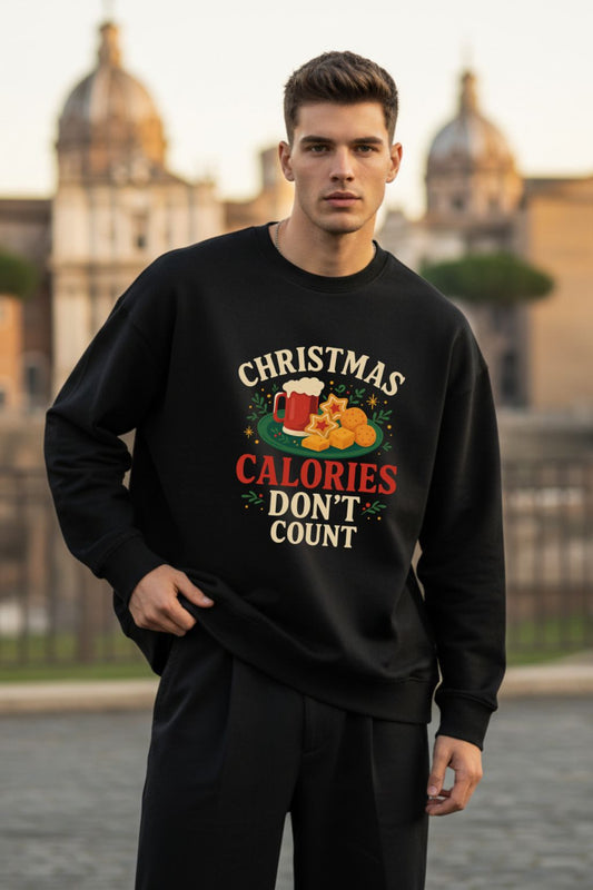 Man wearing a black sweatshirt with Christmas Calories Don't Count design outdoors.