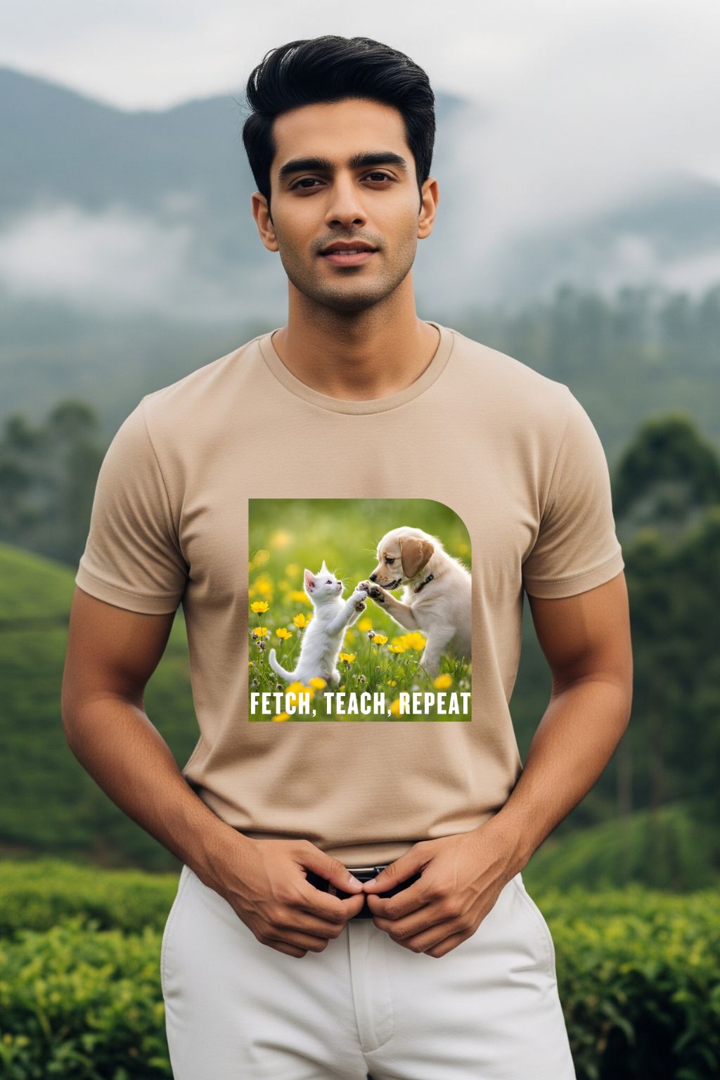 ZUPPI's "Fetch, Teach, Repeat" beige t-shirt, featuring a graphic of a dog and a cat, worn by a man against a mountainous background.