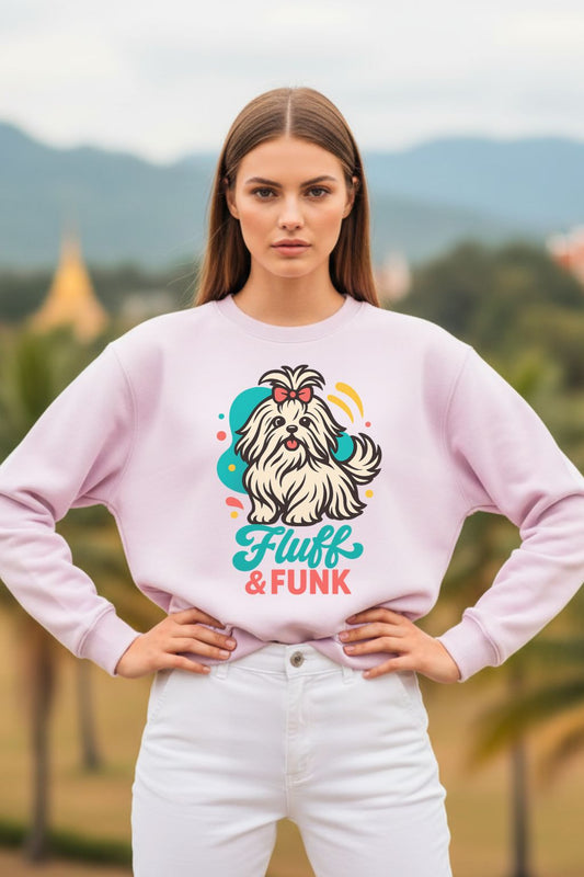 Woman wearing a light baby pink oversized sweatshirt with a dog graphic and 'Fluff & Funk' text, standing outdoors.