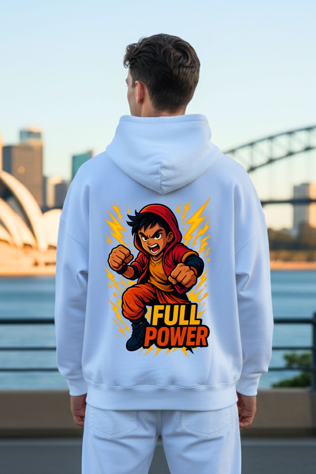 Man wearing a hoodie with a character design and 'Full Power' text, standing against a cityscape.