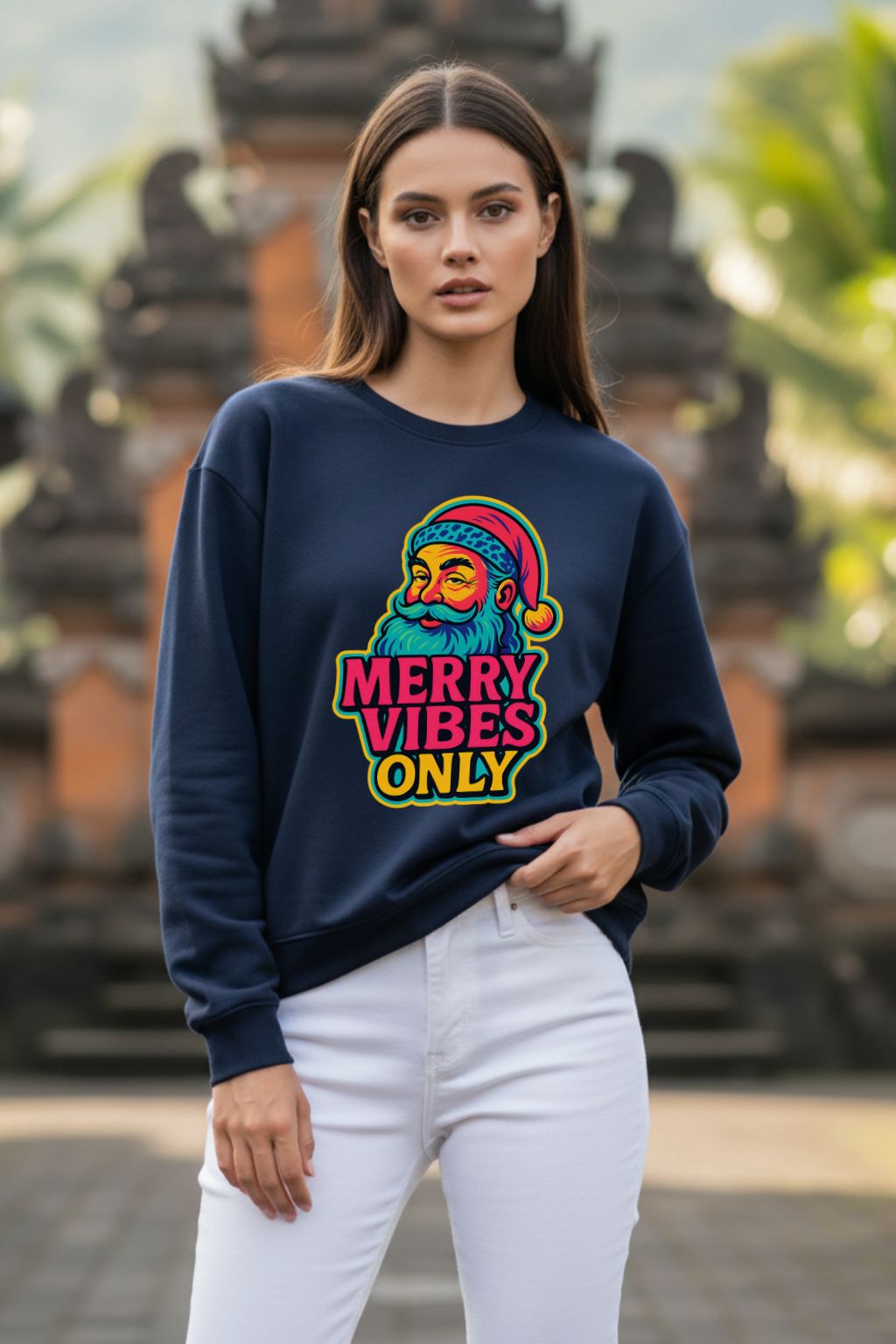 Woman wearing a navy blue oversized sweatshirt with colorful graphic and text, standing outdoors.