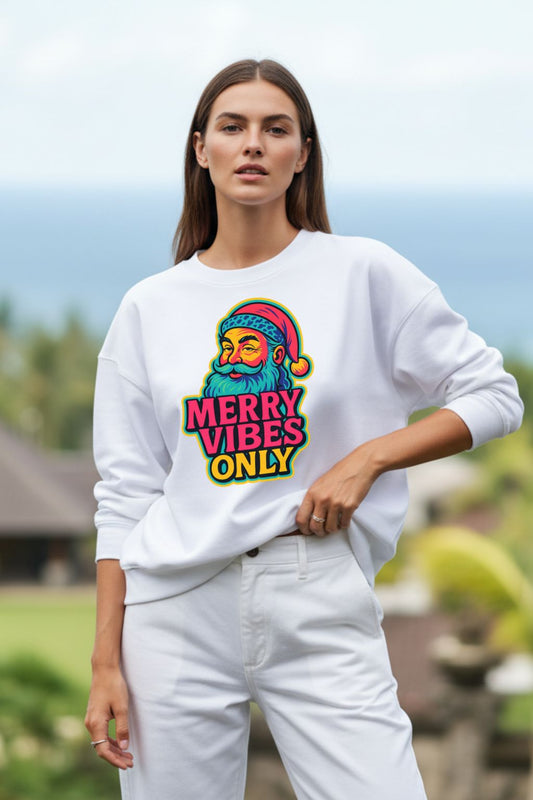 Woman wearing a white oversized sweatshirt with a colorful graphic and text outdoors.