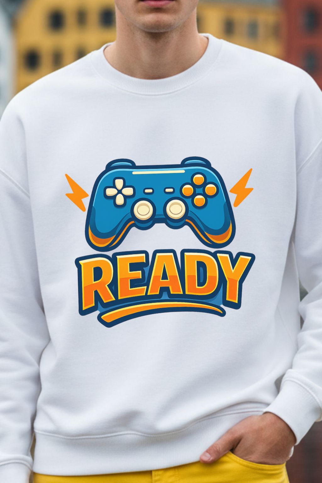 close view of a white oversized sweatshirt with a colorful gaming controller graphic and 'READY' text, worn by a man.