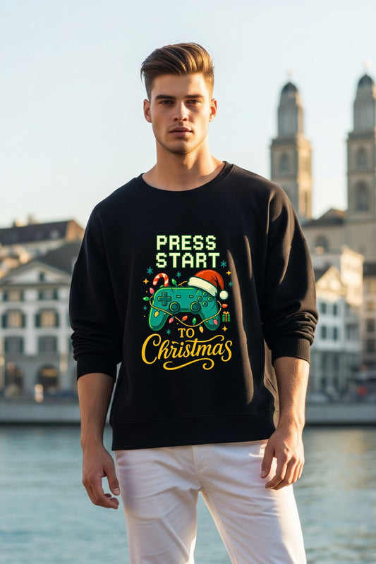 Man wearing a black sweatshirt with Christmas-themed text in an urban setting