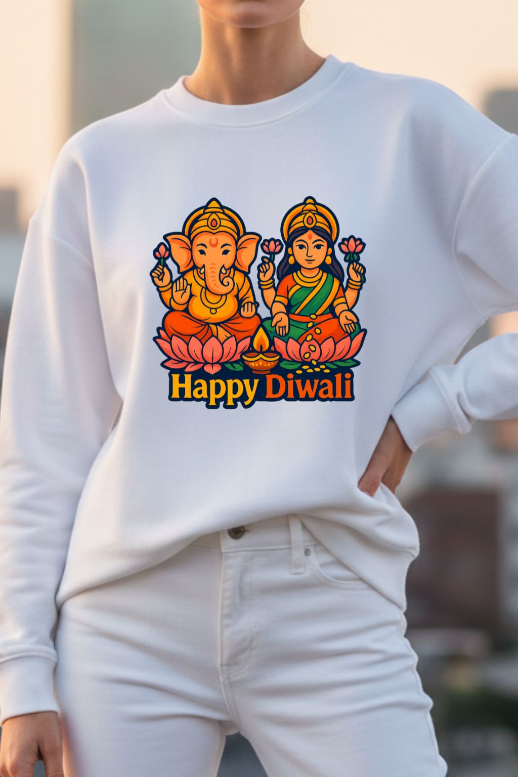 Woman wearing a white sweatshirt with 'Happy Diwali' design featuring Ganesha and Lakshmi.
