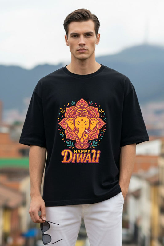 Man wearing a black oversized t-shirt with a colorful 'Happy Diwali' design outdoors.