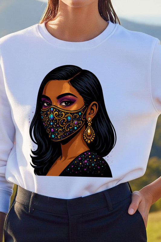 White sweatshirt with a colorful graphic of a woman wearing a face mask, set against a blurred natural background.