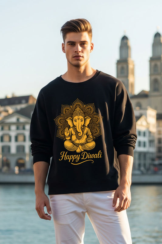 Man wearing a black sweatshirt with gold Ganesha design and 'Happy Diwali' text, standing in front of a scenic background.