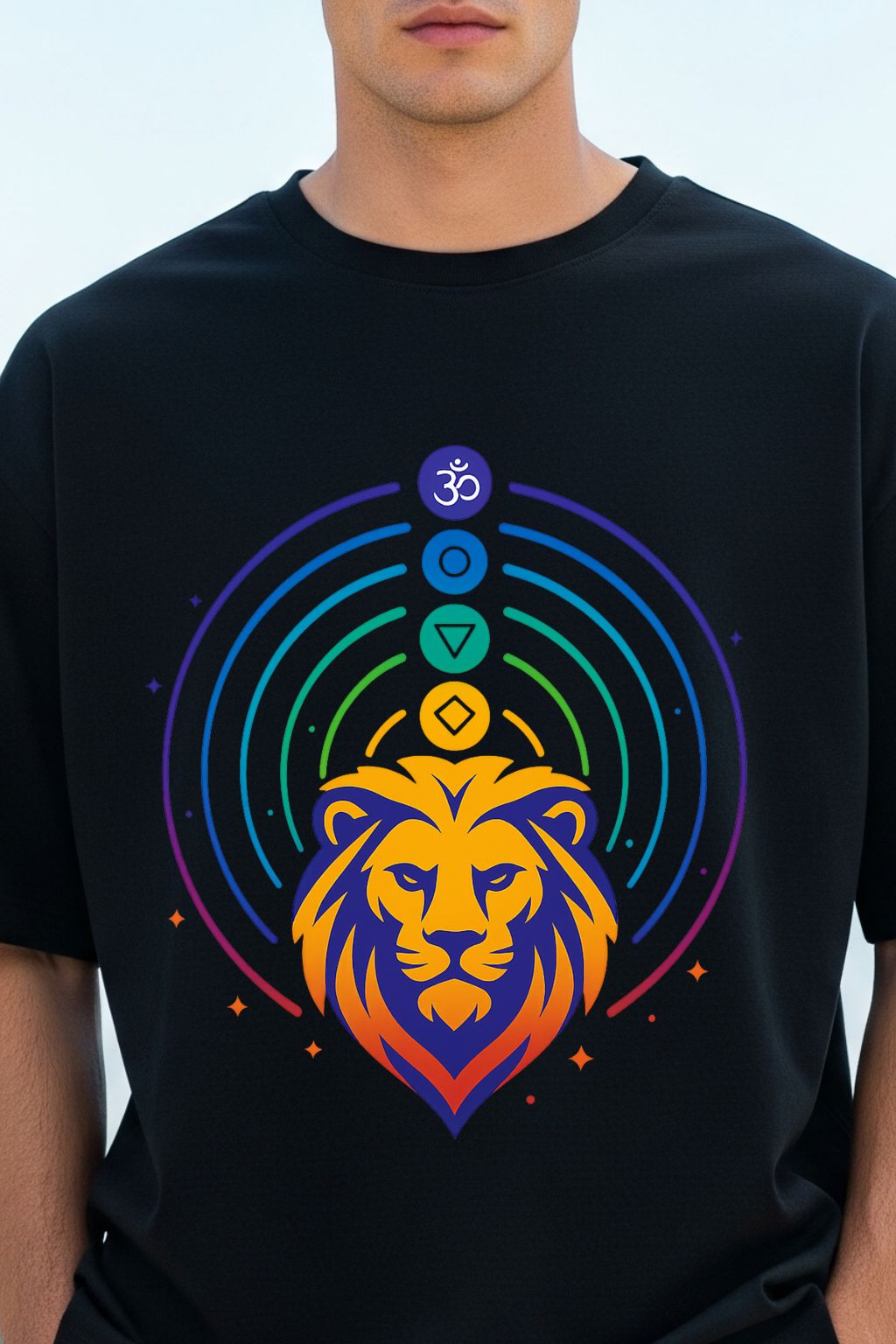 Man wearing a Black t-shirt with a colorful lion graphic and symbols on a light blue background