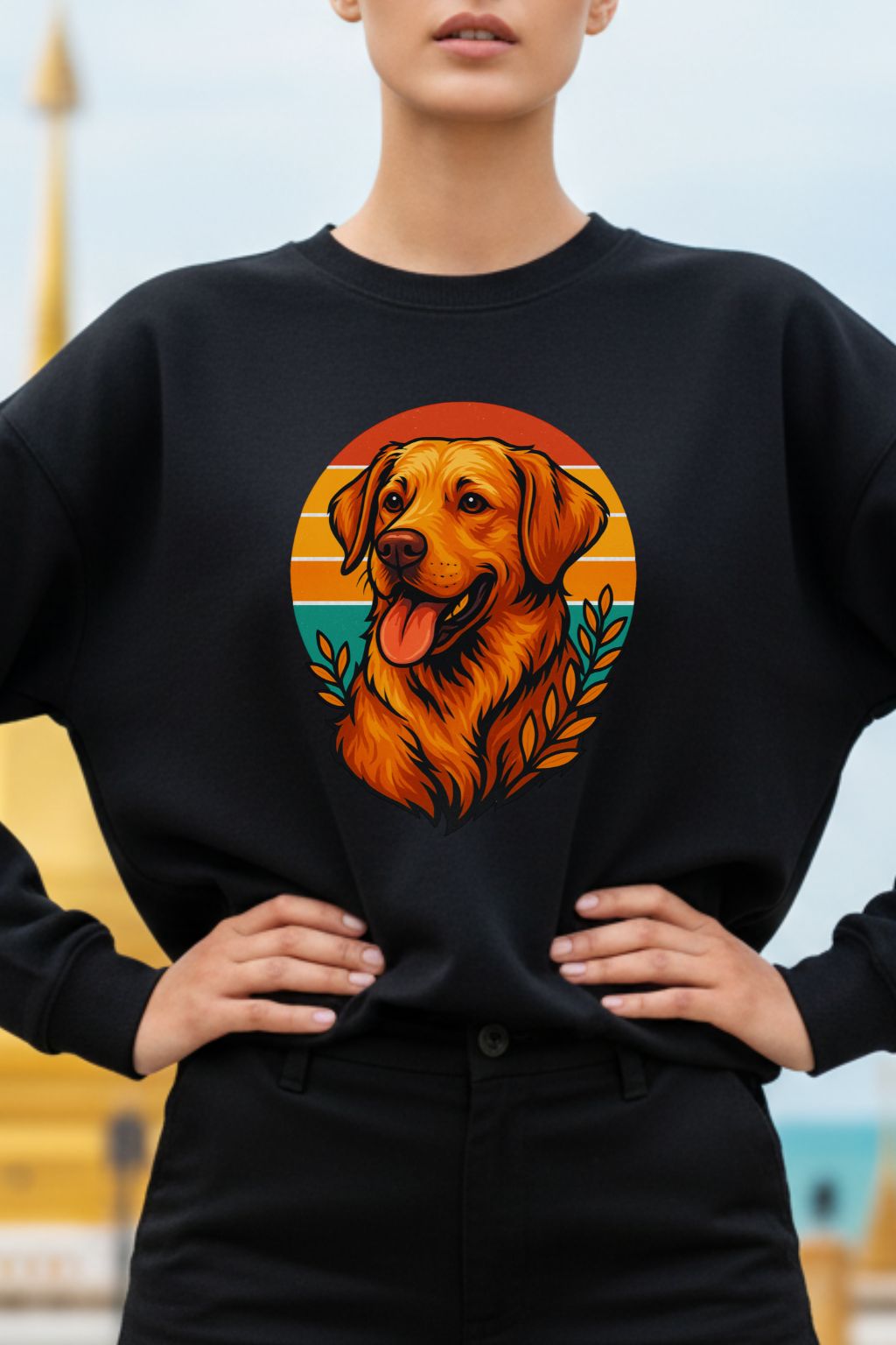 Close up of a woman wearing a black sweatshirt with a dog graphic on a blurred outdoor background