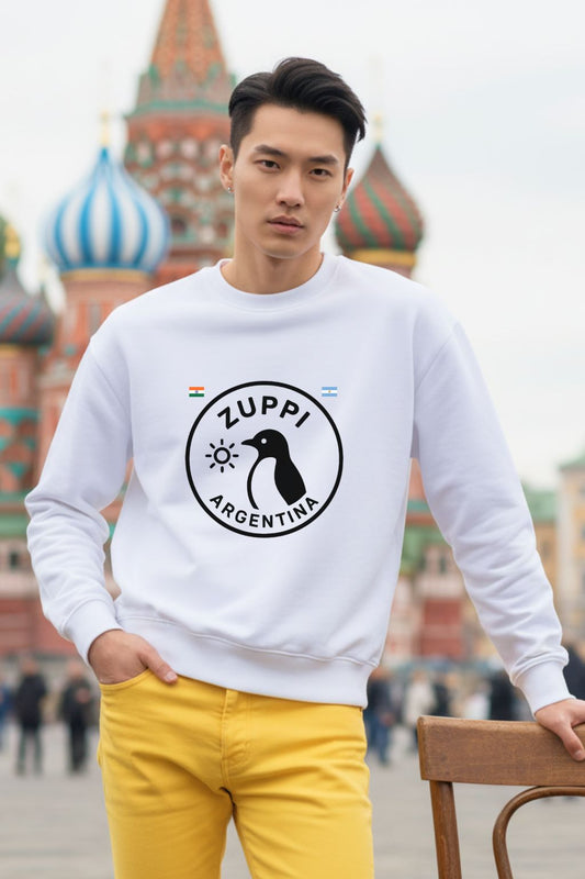 Man wearing a white sweatshirt with a penguin image for Argentina in front of a colorful building