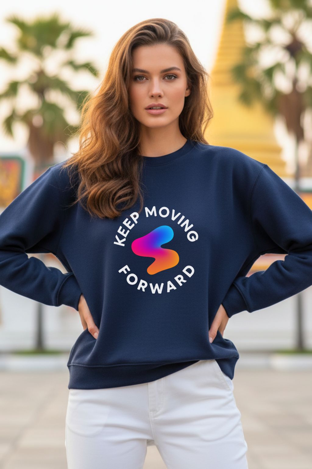Woman wearing a navy blue oversized  sweatshirt with 'Keep Moving Forward' text and colorful logo.