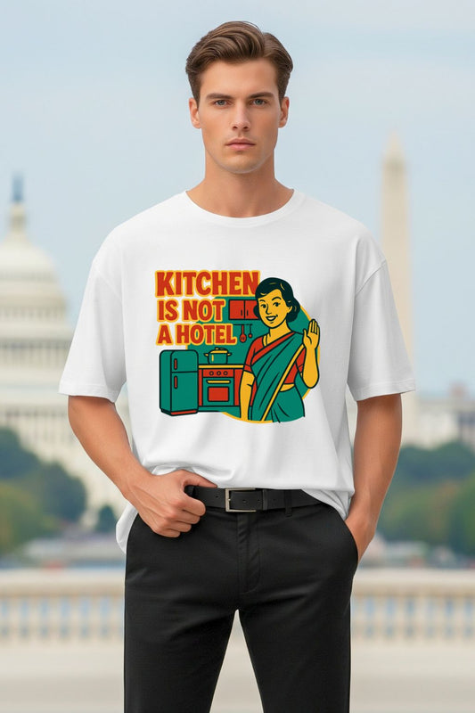 Man wearing a white t-shirt with a graphic design in front of a blurred background