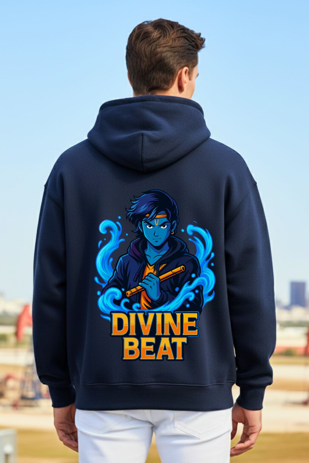 close up of a man wearing a navy blue oversized hoodie with 'Divine Beat' design outdoors
