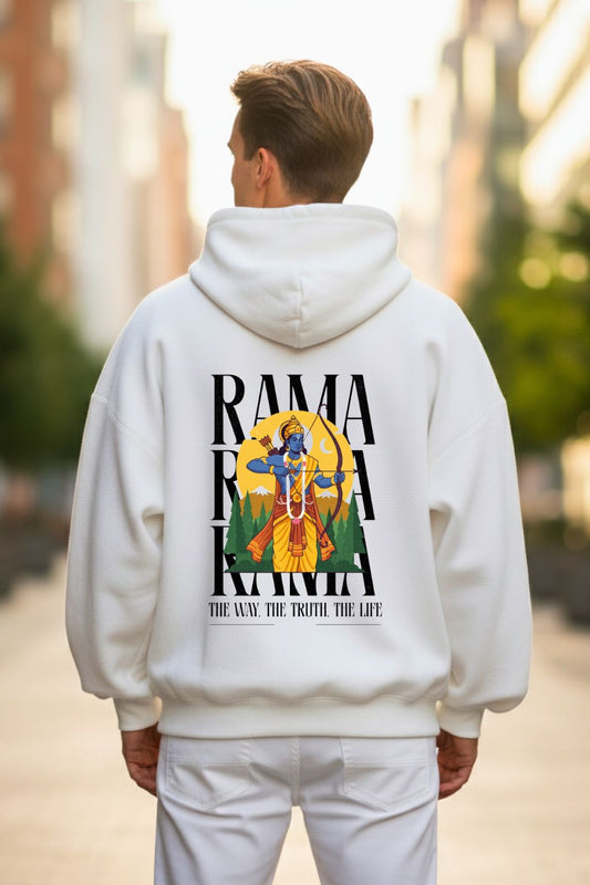 man wearing a white hoodie with a colorful graphic of Lord Rama Bow and his teaching on the back, standing outdoors.