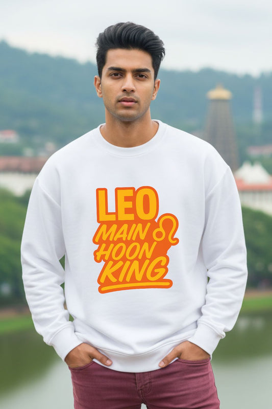 Man wearing a white oversized  sweatshirt with orange text in an outdoor setting