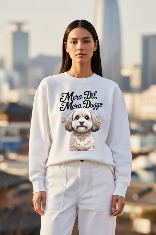 Woman wearing a white oversized sweatshirt with a dog graphic and text, standing in front of a cityscape.