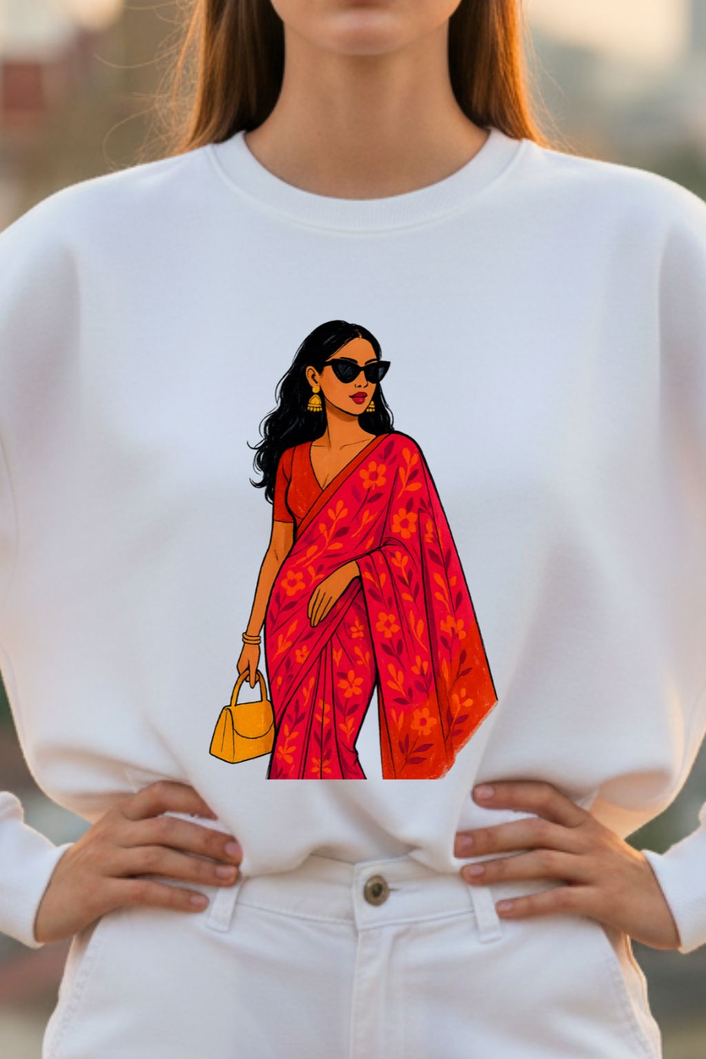 White sweatshirt with a colorful graphic of a woman in a red saree.