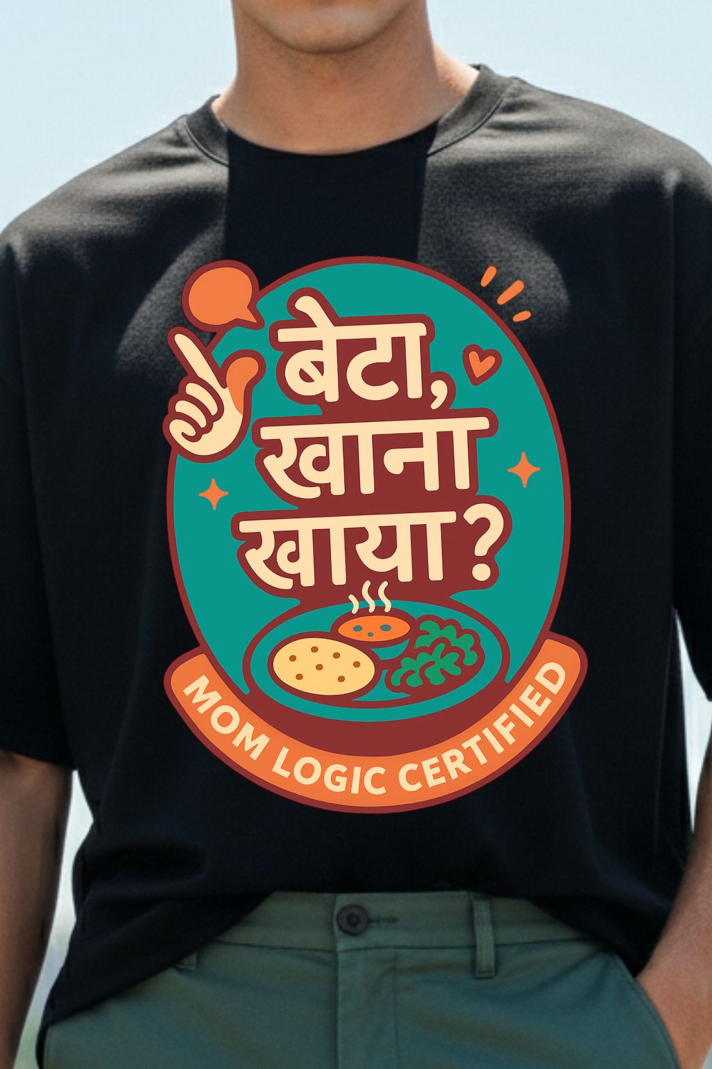 Man wearing a black t-shirt with a colorful graphic design of "Beta, Khana Khaya" on a clear blue sky backgroun