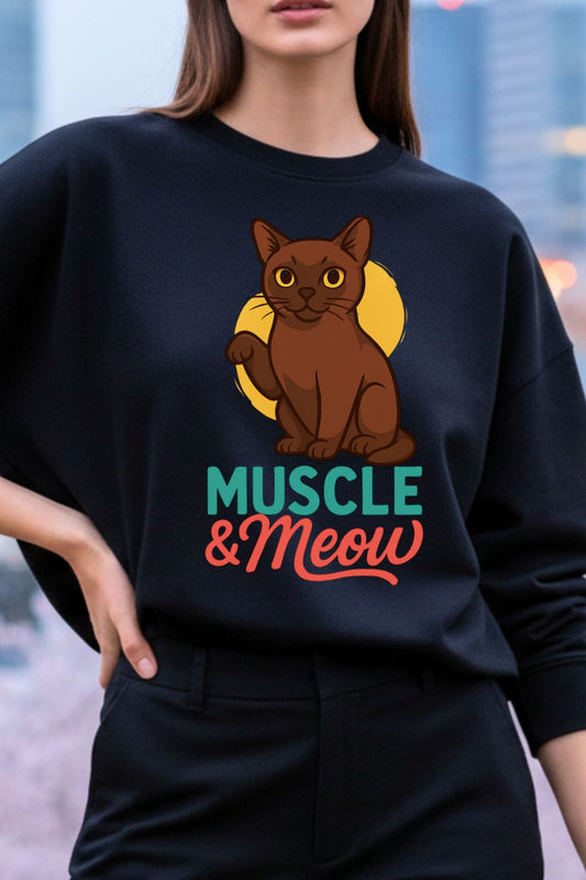 close up view of a woman wearing a black oversized sweatshirt with a cat graphic and 'Muscle & Meow' text.