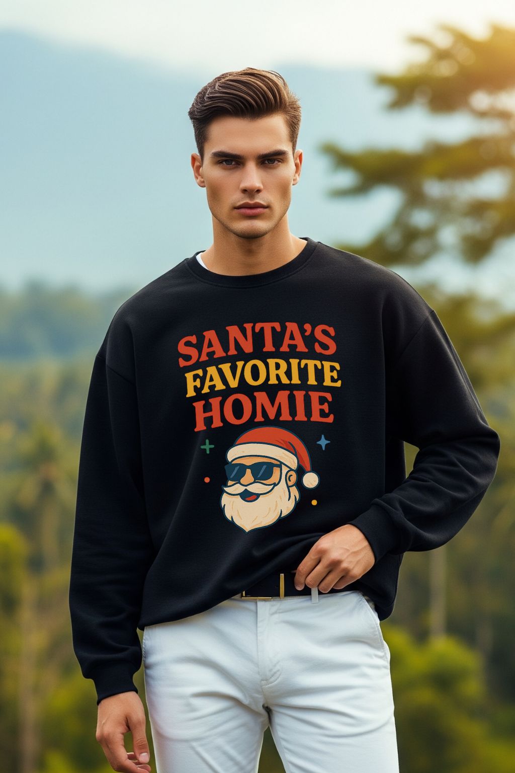 Man wearing a black oversized sweatshirt with 'Santa's Favorite Homie' text and graphic, standing outdoors with trees in the background.