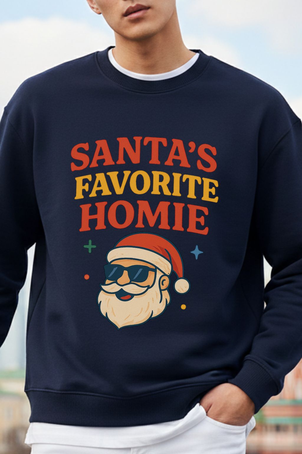 close up of a navy blue oversized sweatshirt with 'Santa's Favorite Homie' text and Santa Claus graphic.