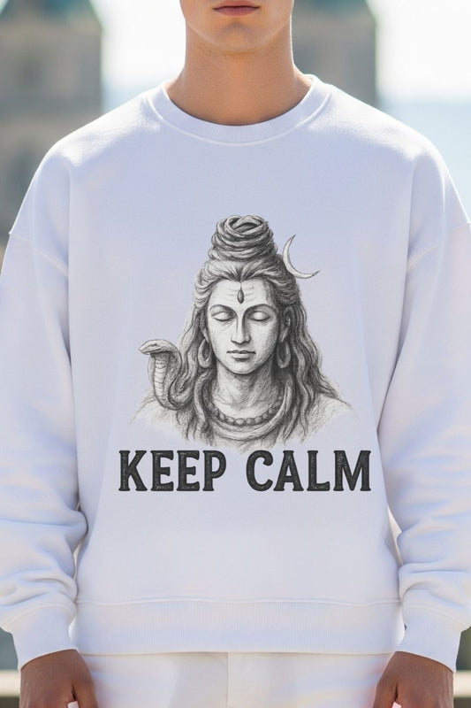 Close up view of a white sweatshirt with a graphic of Lord Shiva with 'KEEP CALM' text, worn by a person.