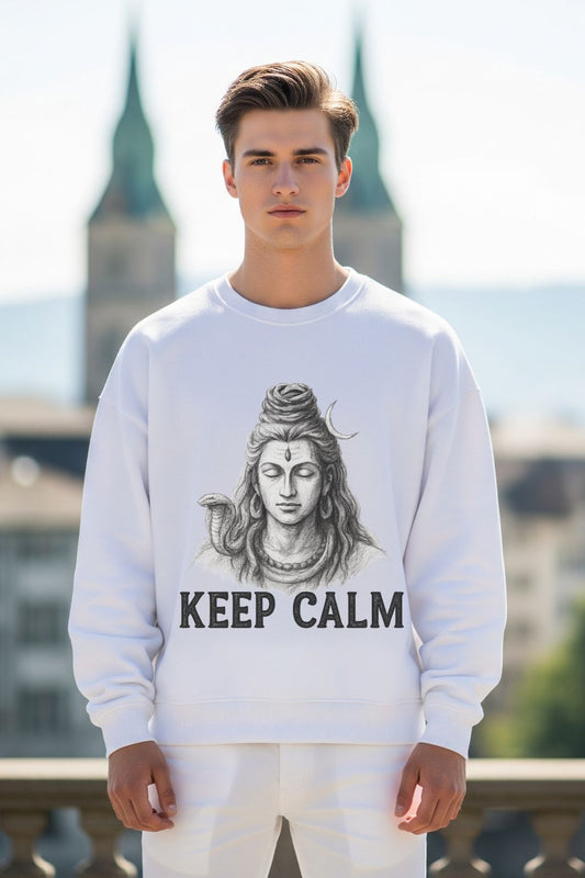 Person wearing a white sweatshirt with a graphic design of Lord Shiva with 'KEEP CALM' text, standing outdoors.