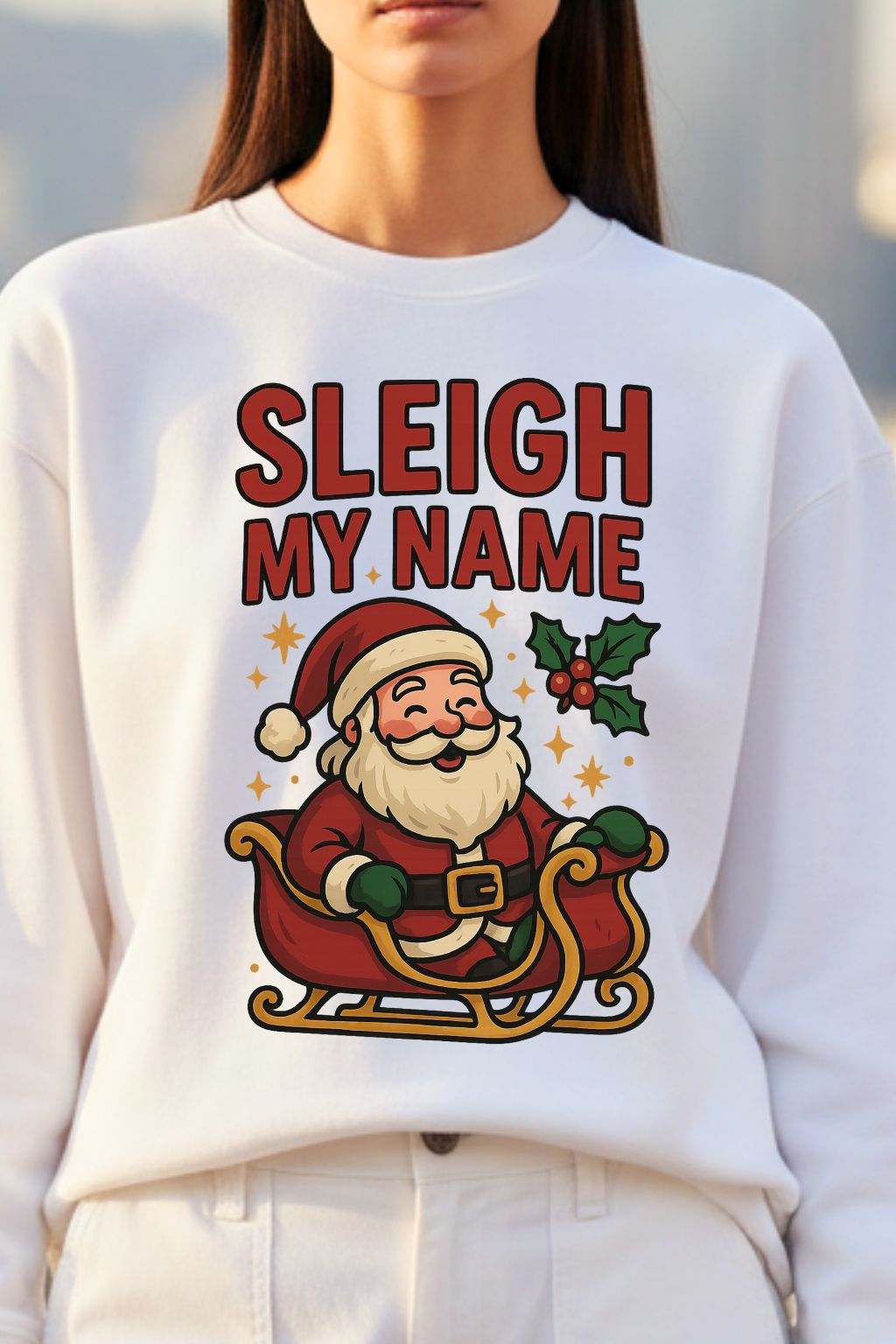 close up of a white oversized sweatshirt with Santa Claus graphic and 'Sleigh My Name' text