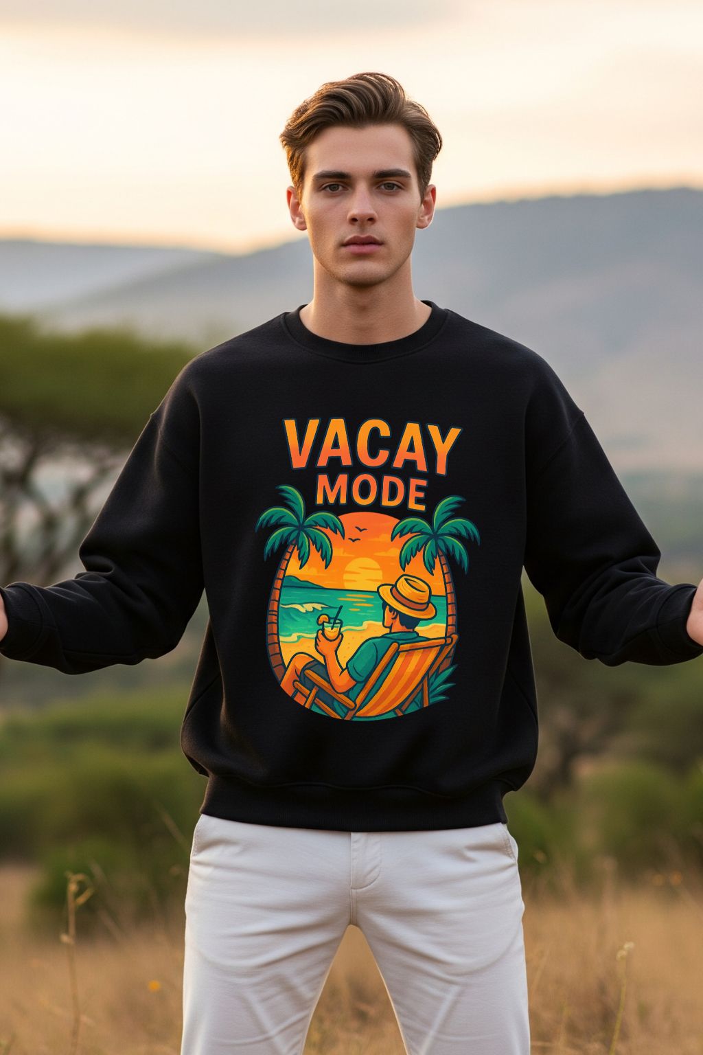 Man wearing a black sweatshirt with 'Vacay Mode' design outdoors