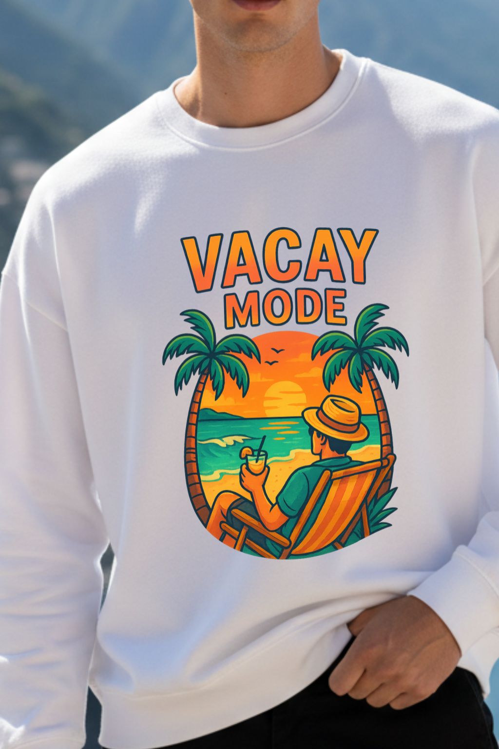 White sweatshirt with 'Vacay Mode' graphic design featuring a beach scene and palm trees.