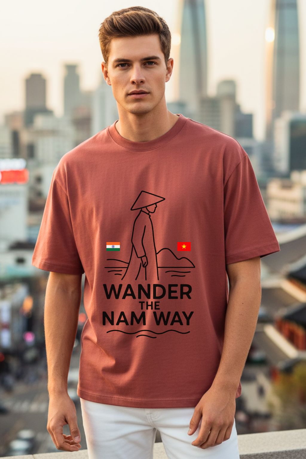 Man wearing a t-shirt with 'Wander the Nam Way' design in an urban setting