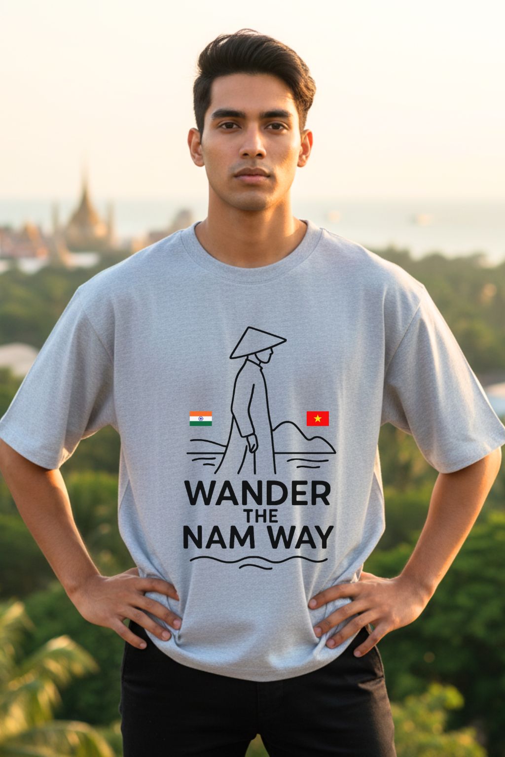 Man wearing a grey melange t-shirt with 'Wander the Nam Way' design outdoors