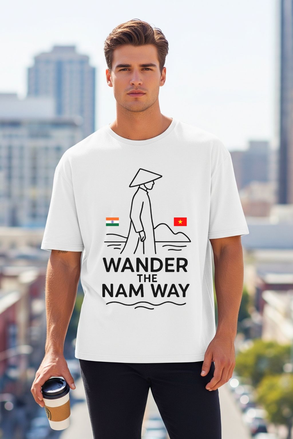 Man wearing a white t-shirt with 'Wander the Nam Way' design in an urban setting