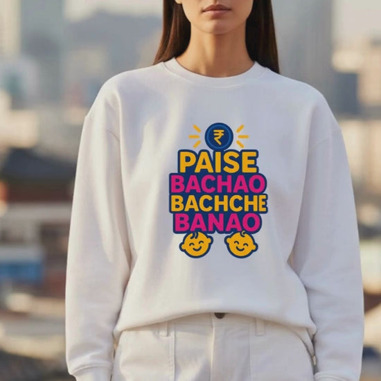 Video of a woman showcasing white oversized sweatshirt having design of Paise Bachao Bachhe Banao 